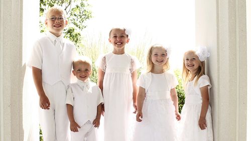 children in white clothing