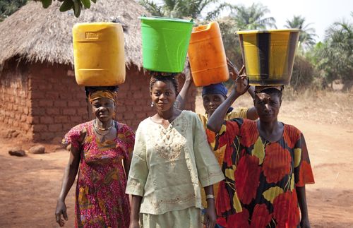 women carrying water on their heads