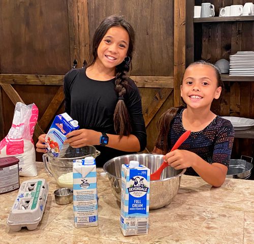 two sisters baking together