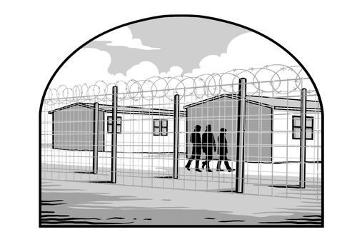 prisoners walking along fence topped with razor wire