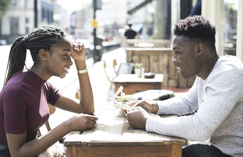 young woman and young man talking