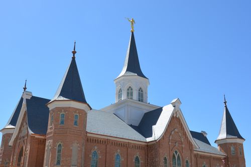The spires of the Provo City Center Temple with a clear blue sky overhead.