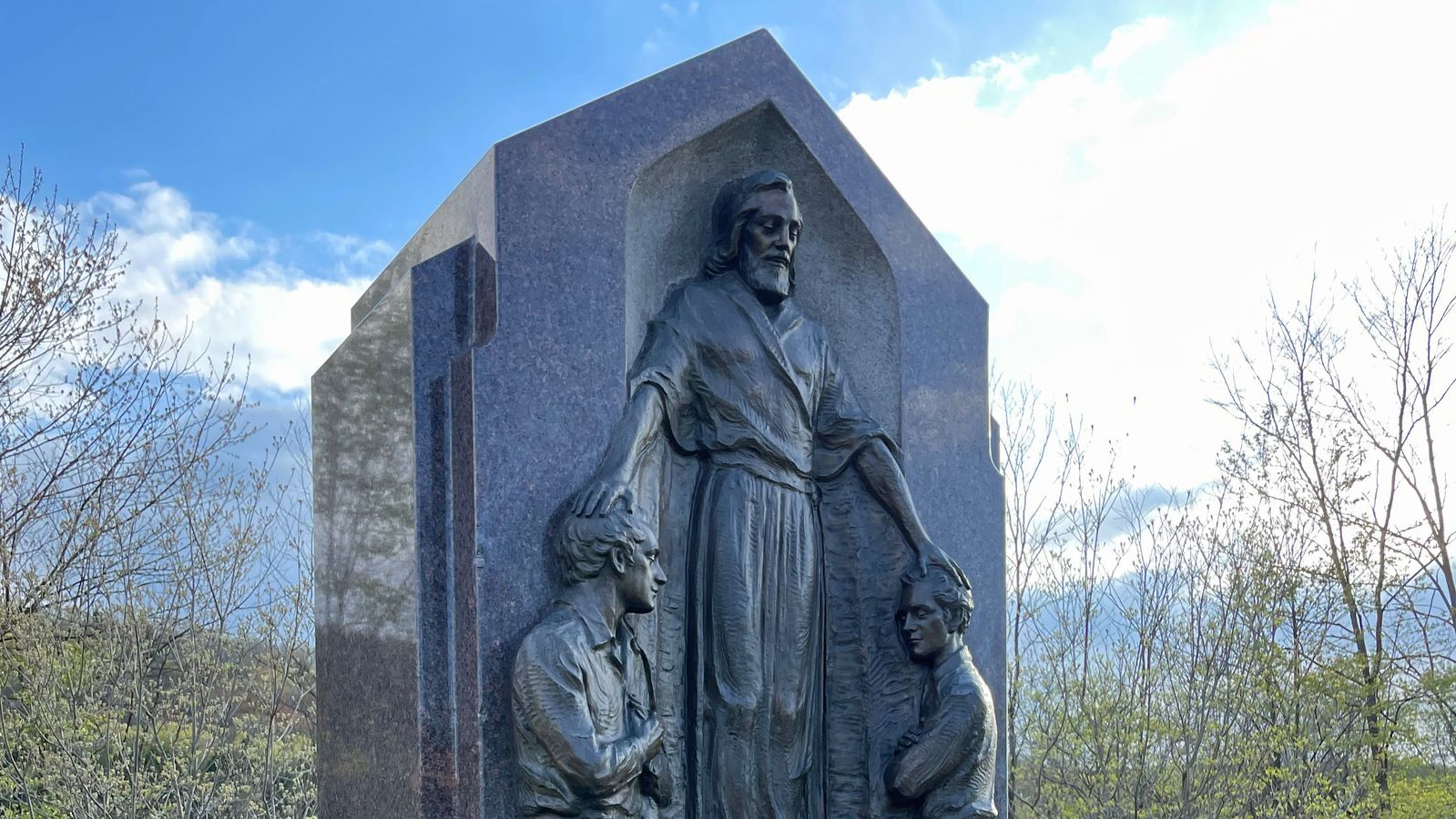 A monument depicting Joseph Smith and Oliver Cowdery receiving the Aaronic Priesthood from John the Baptist. 