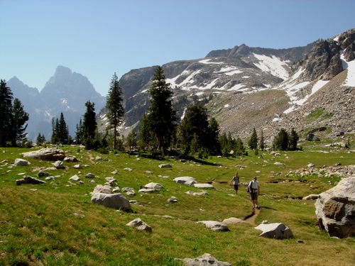 Two hikers on a trail in the Grand Teton National Park.