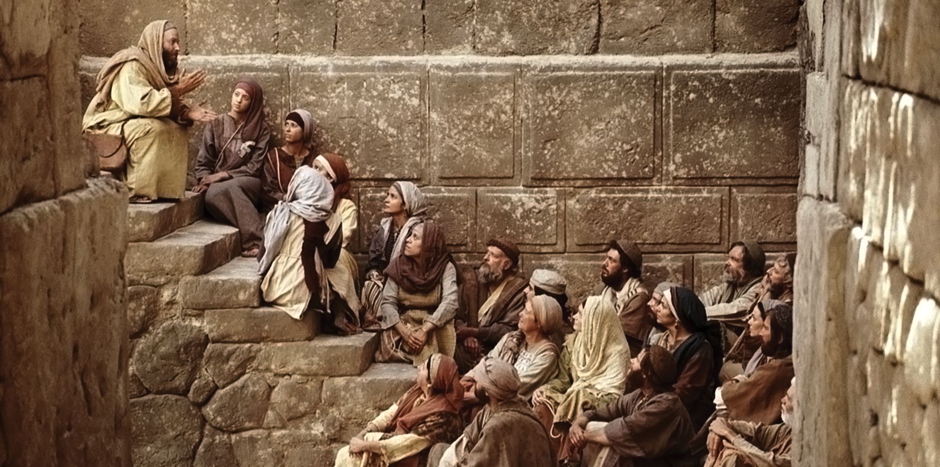Men and women listen to Paul's teachings of Jesus Christ.