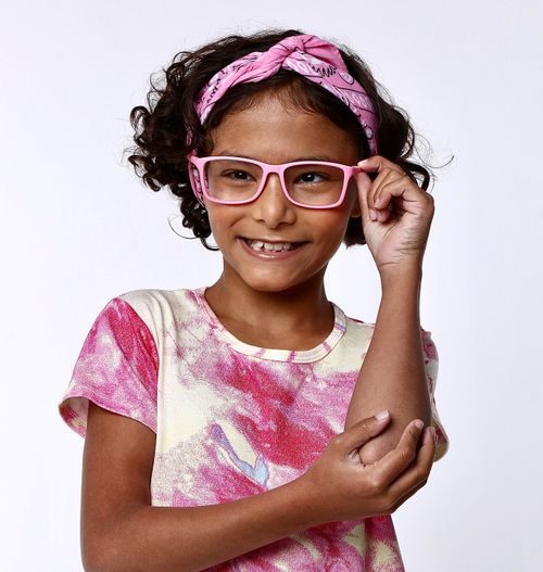 girl in pink shirt with pink-framed glasses