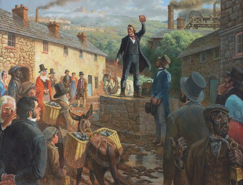 painting of Dan Jones holding Book of Mormon, standing on stone wall preaching to people