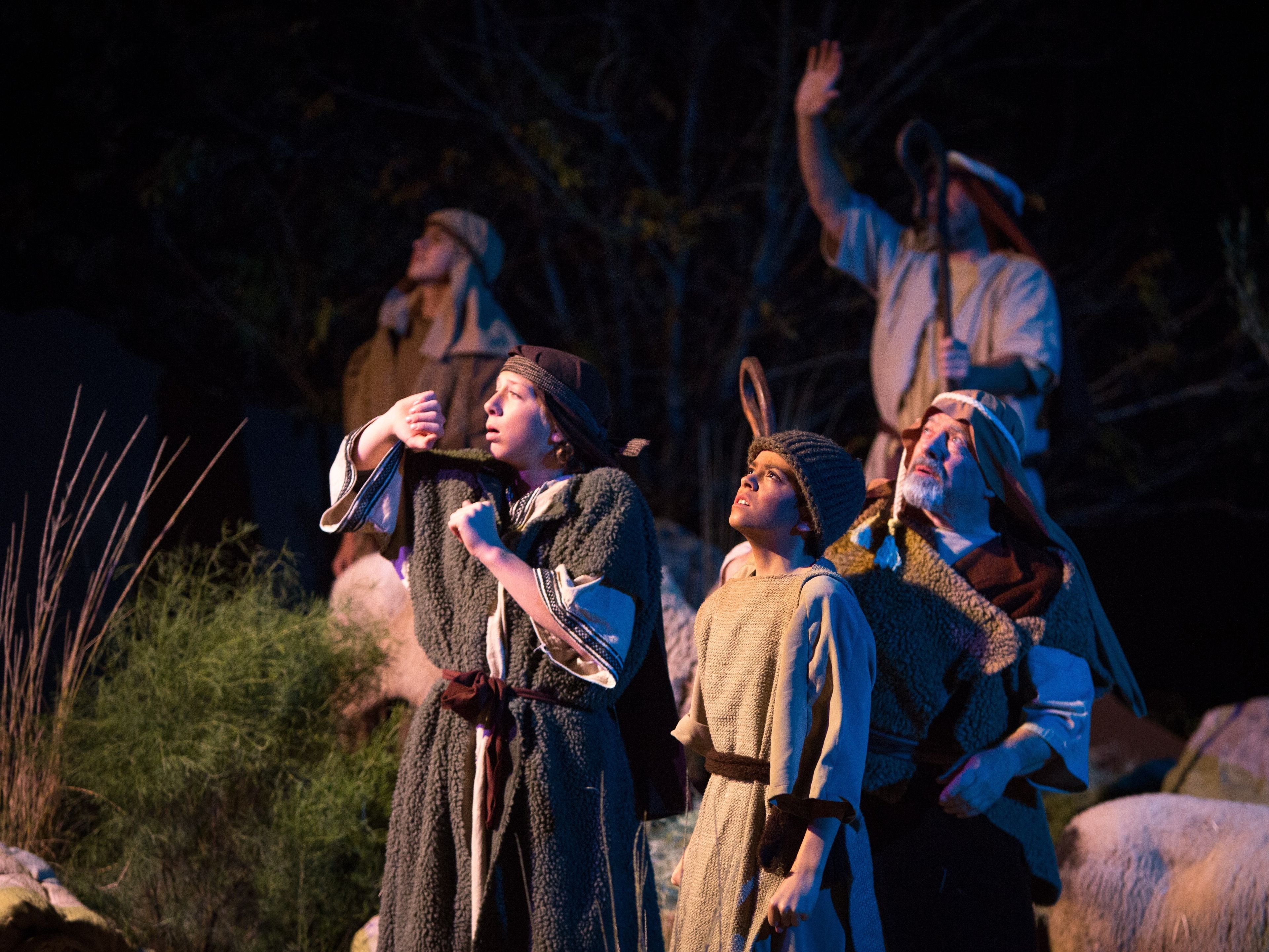 Shepherds in the Arizona Christmas pageant looking up at the sky.