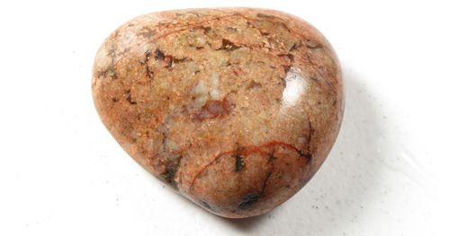 A heart shaped rounded edge rock.