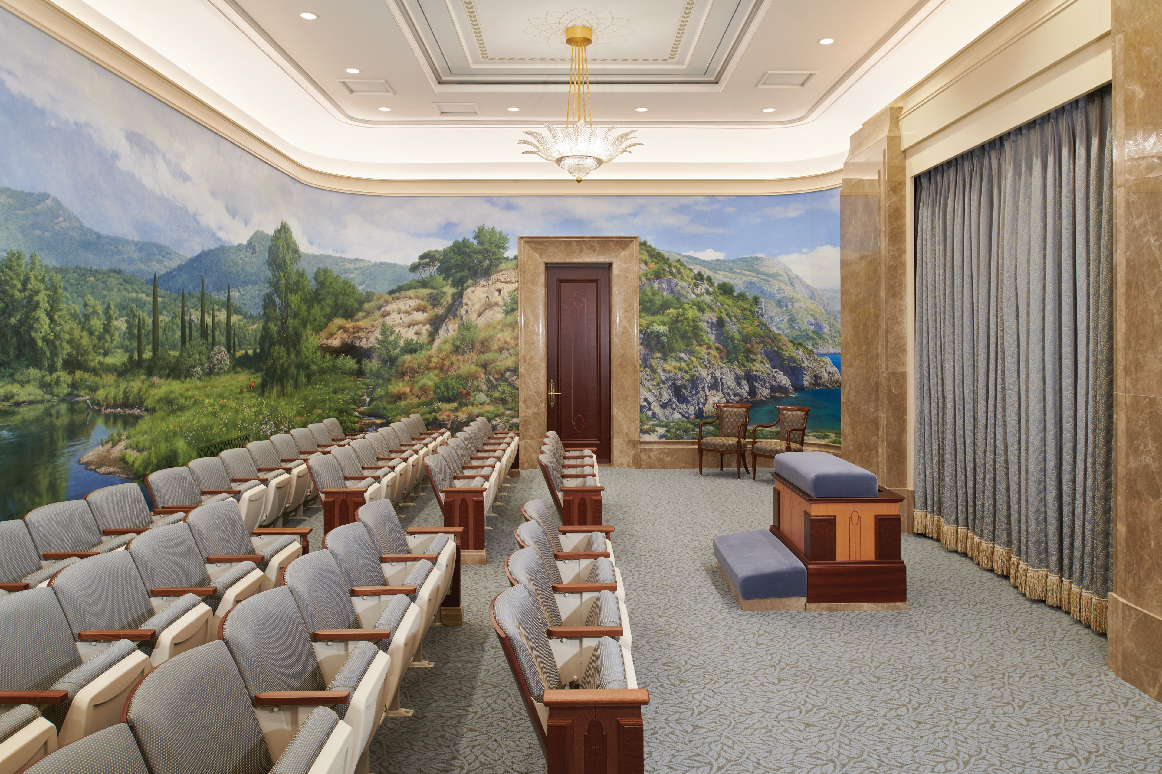 An instruction room in the Rome Italy Temple where patrons make promises with Heavenly Father. The murals on the wall represent the world where we now live.