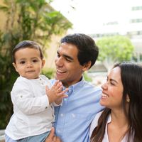 A family walks through the city together.