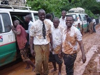 men standing by bus