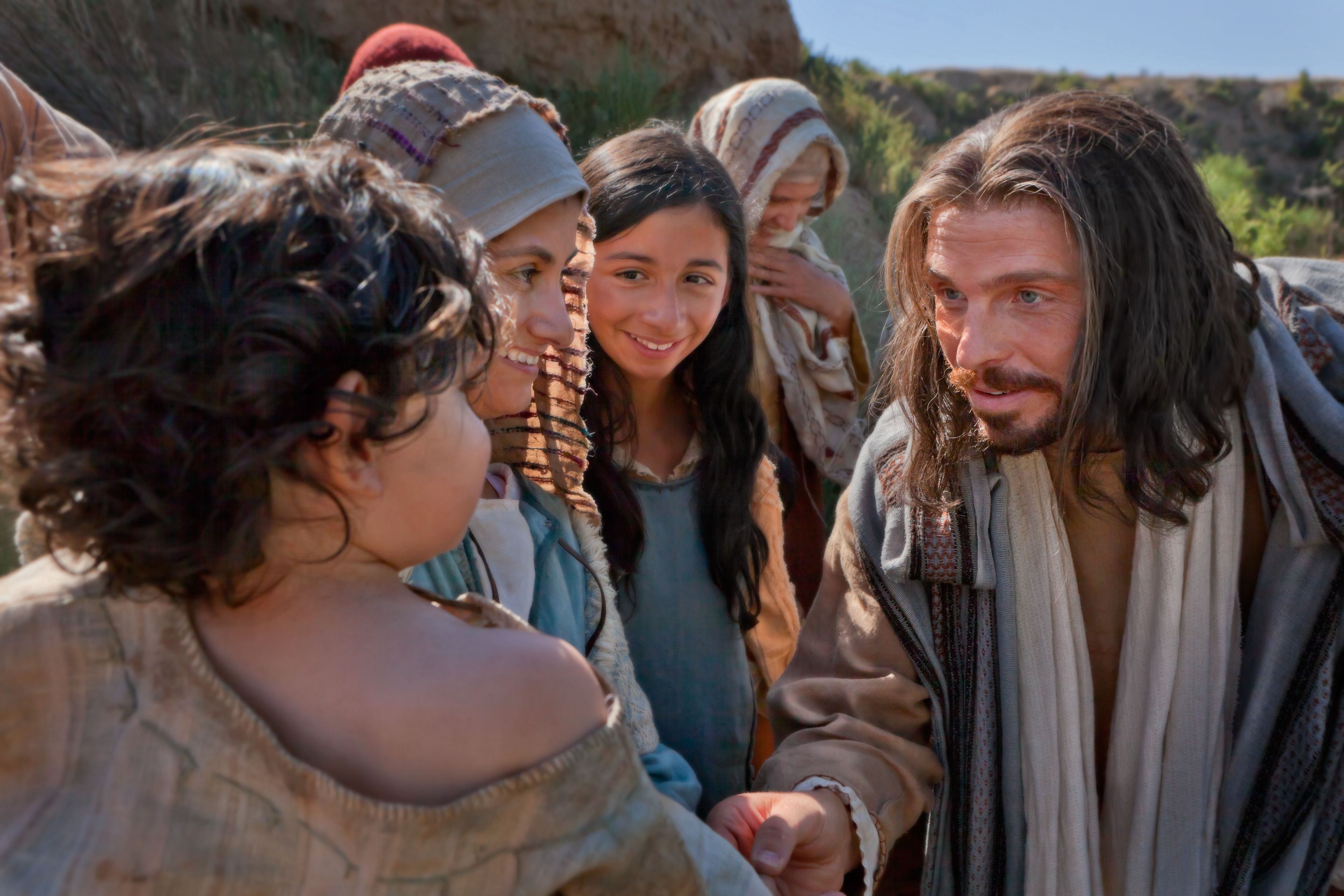 Jesus talking with a child and the child’s mother.