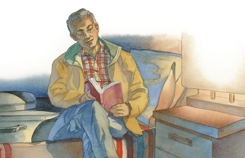 man reading in motel room