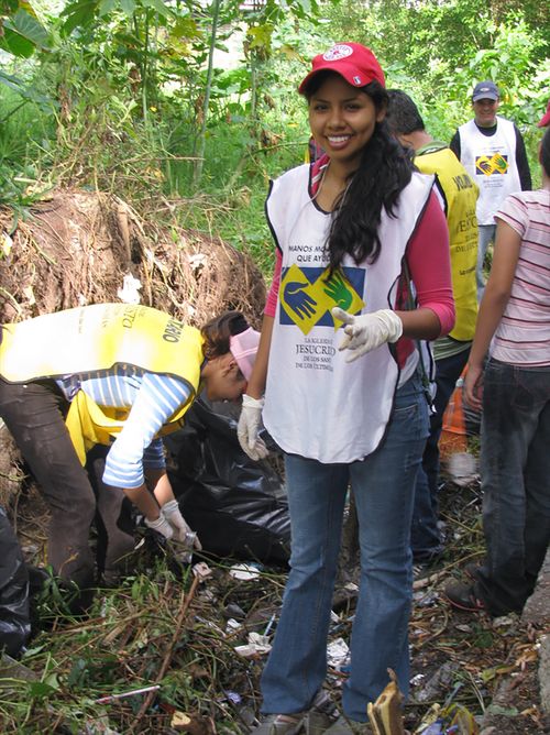 Young woman in Helping Hands vest