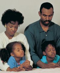 family praying