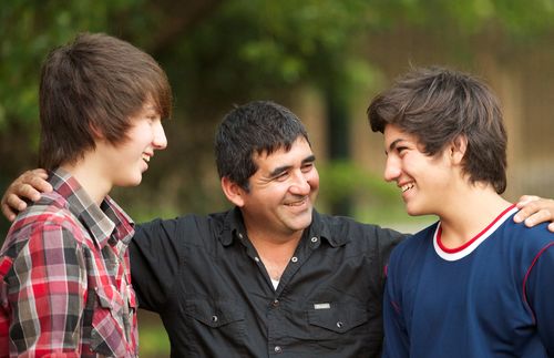 Father with teenage sons