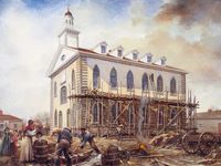 Painting depicting men and women working on the construction of the Kirtland Temple in Kirtland, Ohio.  There are clouds in the sky.