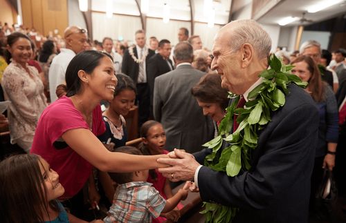 President and Sister Nelson greeting people following a devotional