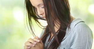 a woman prays