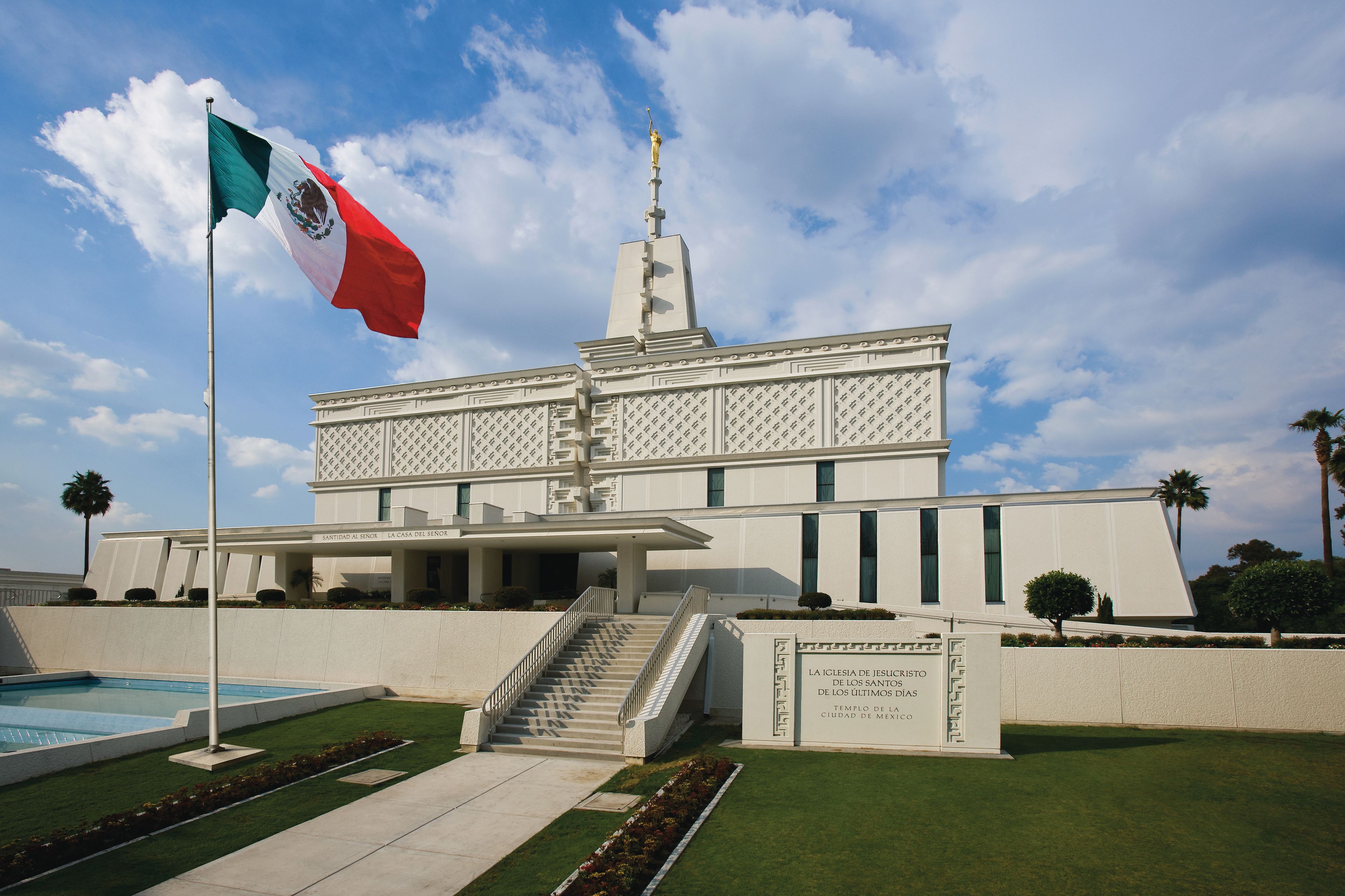 The Mexico City Mexico Temple name sign, including the entrance and flag.