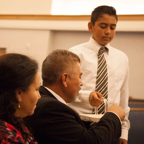 young man passing the sacrament