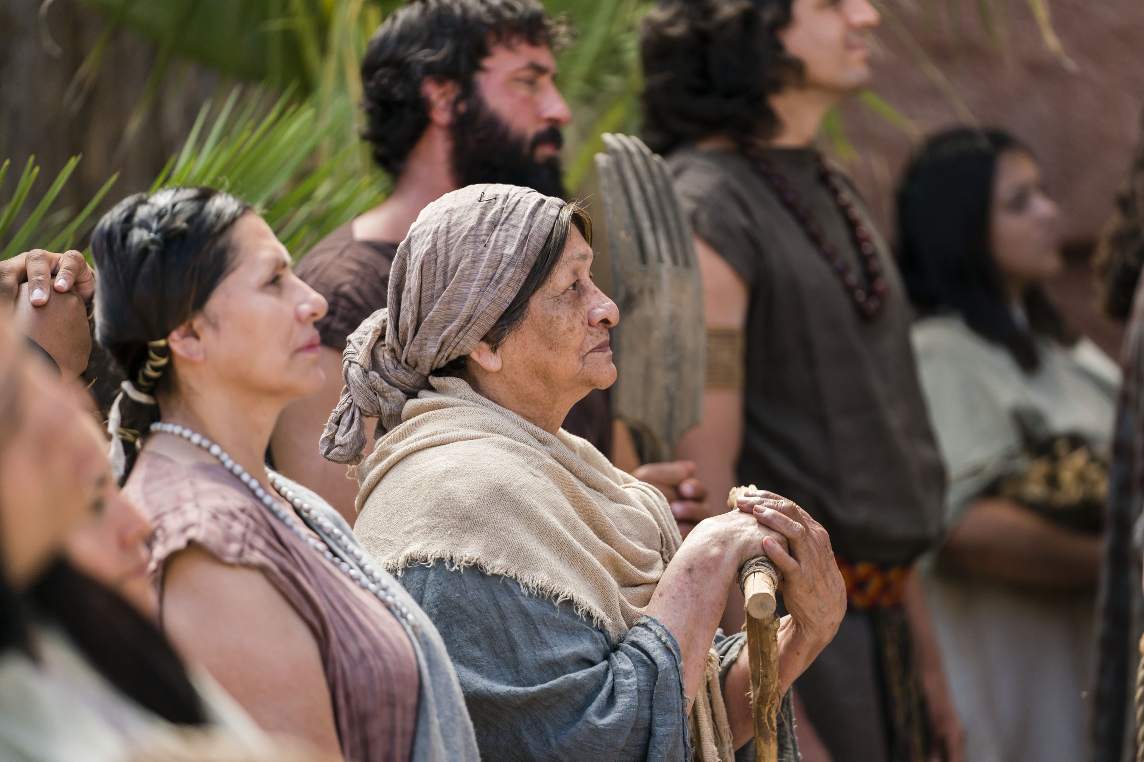 An elderly woman listens as Alma the Younger preaches to the people of Gideon.