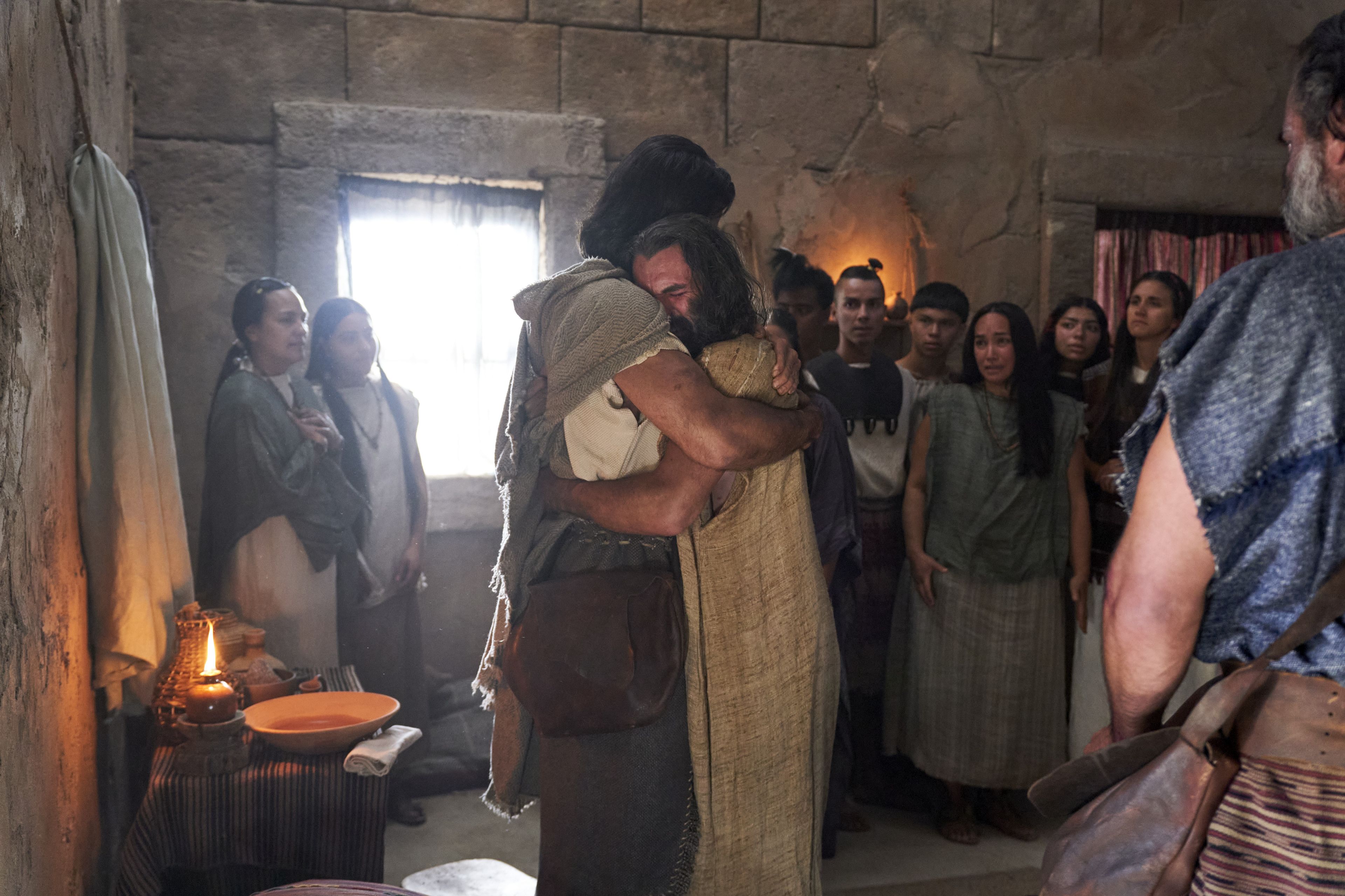 Zeezrom embraces Alma the Younger after being healed by him in the land of Shilom.