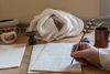 hand writing with quill on parchment
