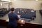 A man speaks to a congregation during a sacrament meeting. Members of the congregation wear face masks to help prevent the spread of COVID-19. From a series of photos of church members attending a sacrament meeting while maintaining social distancing.