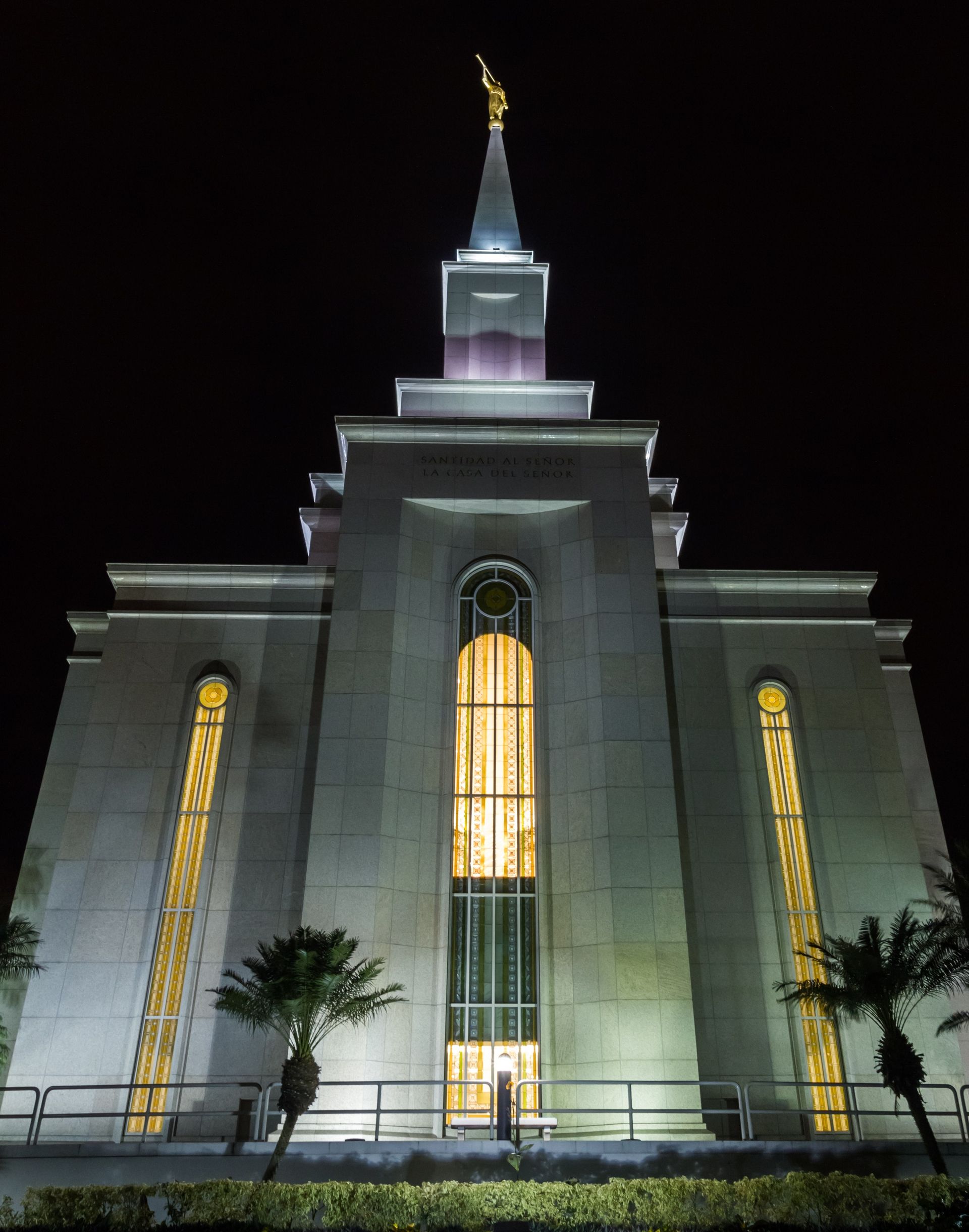 The Guayaquil Ecuador Temple is lit up at night.