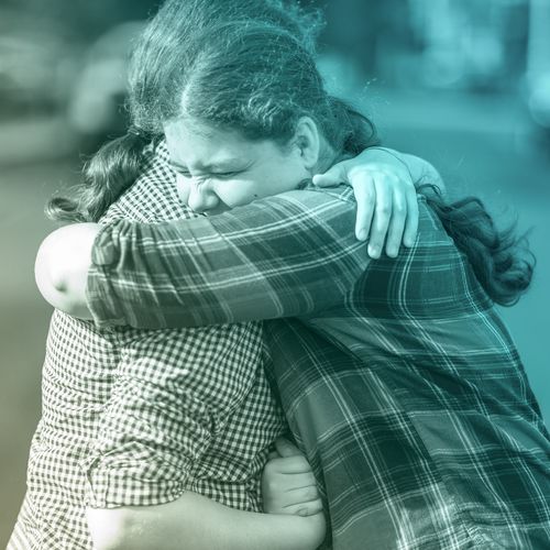 young women hugging