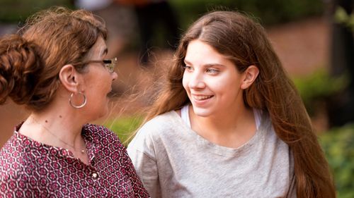 woman and young woman talking