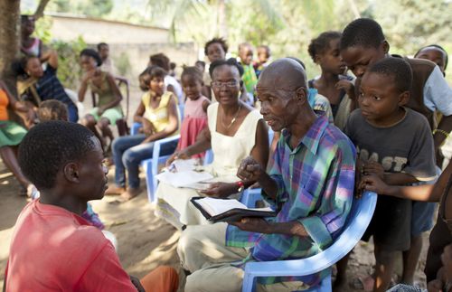 Series of images of people studying in groups, individually, in families sitting in Congo