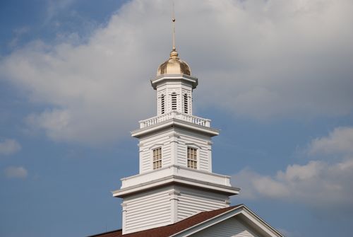 A tall white steeple atop a chapel in Fayette, New York.