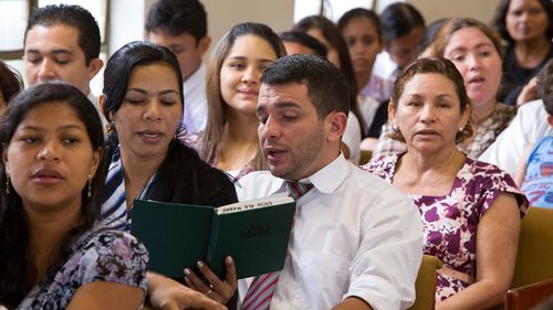 people singing in church