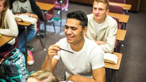 teenager participating in seminary