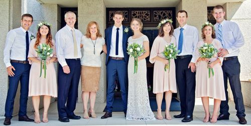 family standing in front of a temple