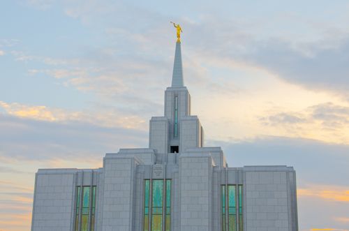 The stained glass and the spire on the Calgary Alberta Temple in the daytime.