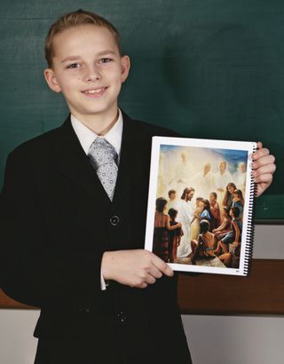 boy holding up picture