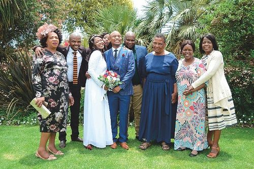 Sister and Brother Mncwabe on the day of their sealing, with family members