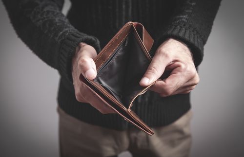 man holding empty wallet