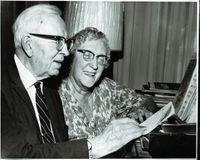 President Joseph Fielding Smith Jr. and Sister Jessie Ella Evans Smith sitting together at a piano.