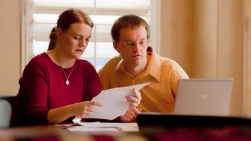 couple looking at papers