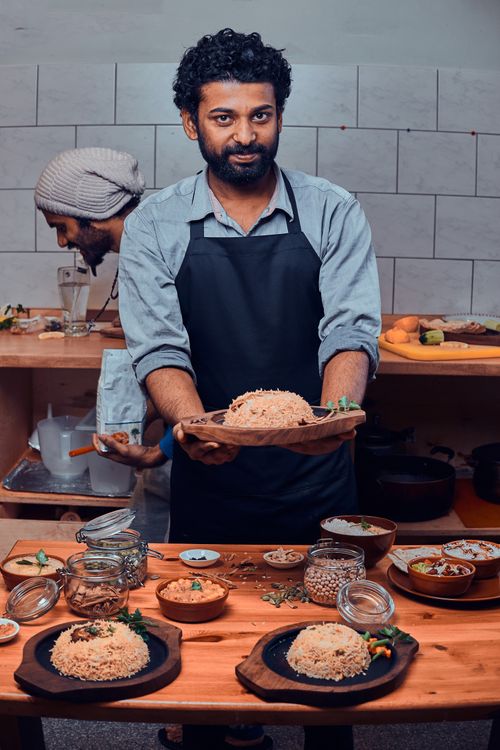 Man prepares food in restaurant