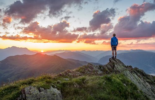 man watching a sunrise