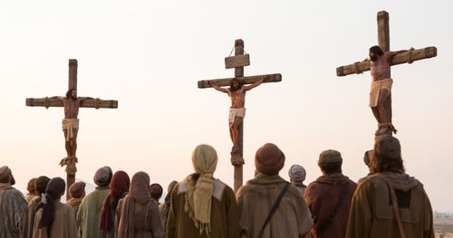 Jesus hanging on the cross between two thieves