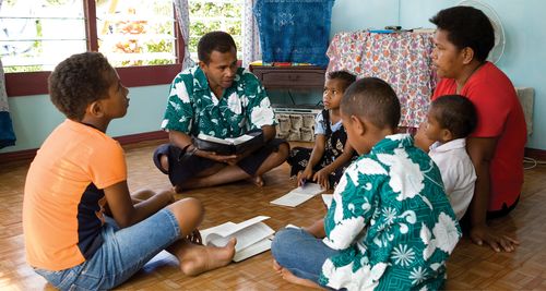 father teaching children