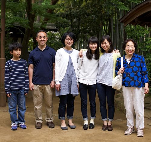 portrait of grandma, mother, father, and three kids