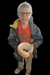 Benji W. holding salamander in a bowl